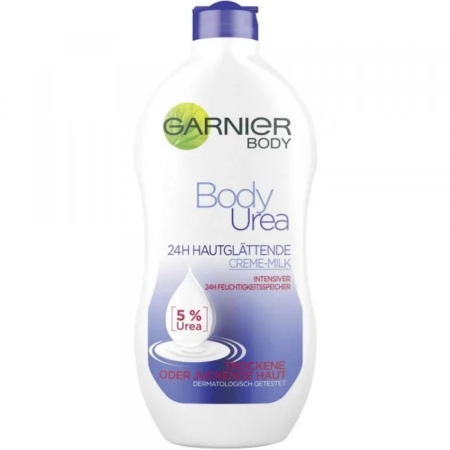 Un flacon de « Garnier Body Urea Lait Crème Lissant 5 % d'urée pour peaux sèches et rugueuses » de 400 ml est présenté sur un fond blanc. Dakar