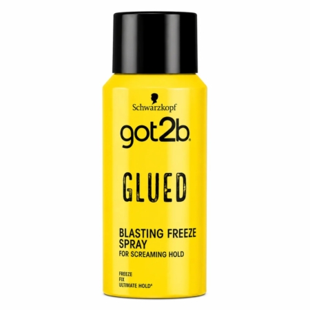 Une bombe jaune de spray « Glued Blasting Freeze » de la marque got2b par Schwarzkopf, dont l'étiquette vante une tenue « screaming hold » et une tenue « ultime », avec un texte et un bouchon noirs. Dakar