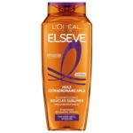 Un flacon orange de shampoing L'Oréal Paris Elseve Huile Extraordinaire Amla pour des boucles bien définies, destiné aux cheveux secs et bouclés, promettant 8 semaines de boucles bien définies. Dakar