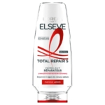 Un flacon d'après-shampoing L'Oréal Paris Elseve Total Repair 5, dont l'étiquette est rédigée en français, destiné aux cheveux abîmés, avec un texte rouge et noir sur fond blanc. Dakar