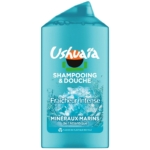 Flacon bleu de shampoing et gel douche Ushuaïa, portant la mention « Fraîcheur Intense » et « Minéraux Marins de l’Atlantique ». Il présente sur le devant un motif représentant des éclaboussures d’eau et un texte en blanc. Dakar